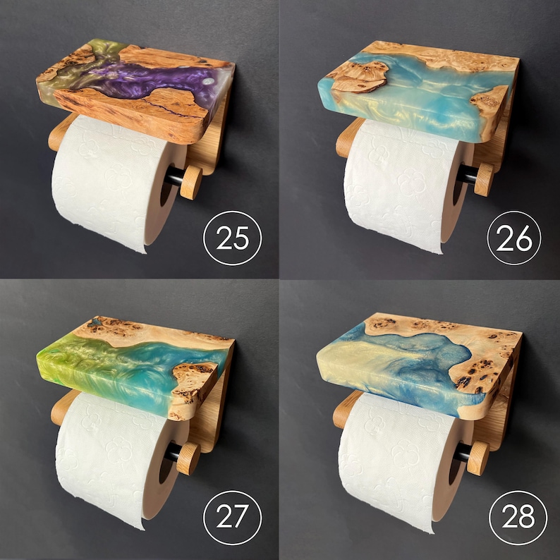 May include: Four wall-mounted toilet paper holders featuring a wooden shelf with embedded colored resin. Each unit holds a roll of white toilet paper on a wooden dowel with a black end cap. The resin colors include purple, light blue, and green.