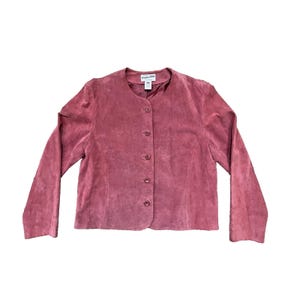 May include: A dusty rose-colored suede jacket with a round neckline and long sleeves. The jacket has a button-up front with five buttons. The brand name "Pendleton" is visible on the label.