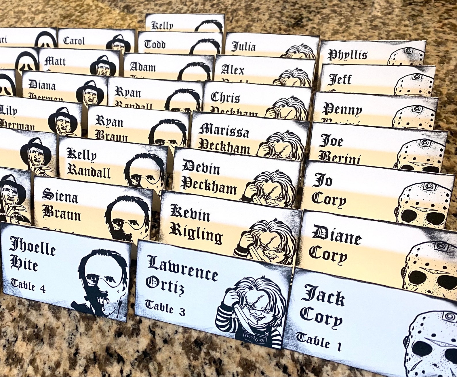 Character Portraits for a Horror-Themed Dinner Halloween place-card preview with monochrome horror-character portraits and guest names.