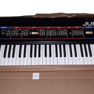 Roland JUNO-6 Analog Keyboard Synthesizer (1982) – Vintage Polyphonic Synth with Original Manual