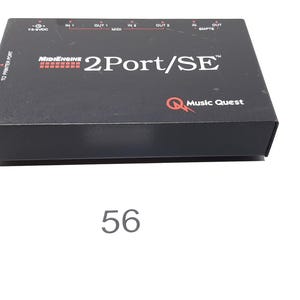 May include: Black box with the text "2Port/SE" and the logo "Music Quest" in red. The box is labeled "MidiEngine" in red.