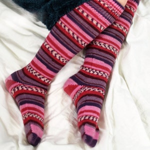 Long, durable woolen socks made from special yarn. Vibrant colors and lasting quality. Perfect gift for any occasion, packed in lovely packaging. Hand-knitted and warm. Available in 14 colors. Ideal for machine washing. Comfort and style combined.