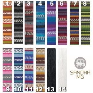 May include: A collection of colorful yarn samples, each with a unique pattern and color scheme. The samples include various shades of blue, green, red, and purple, with some featuring geometric designs. The image also includes black and white yarn samples.