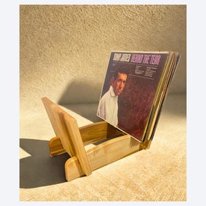 Record Display Stand made from Solid Hardwood. Display your vinyl of all sizes easily next to Home Sound System. Arched Bottom.