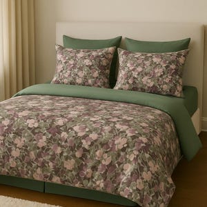 May include: A green and brown floral duvet cover with matching pillowcases. The duvet cover has a subtle watercolour effect and features a repeating pattern of pink and white flowers.