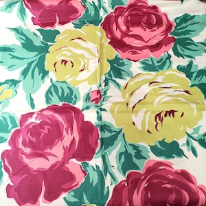 May include: A floral pattern featuring large roses in shades of pink, yellow, and red, set against a white background. The design includes green leaves and buds, creating a vibrant and colorful textile pattern.