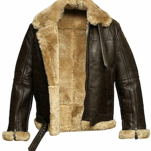 May include: A brown leather bomber jacket with a shearling lining. The jacket has a zipper closure and two pockets on the front.
