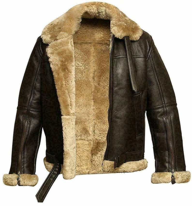 May include: A brown leather bomber jacket with a shearling lining. The jacket has a zipper closure and two pockets on the front.