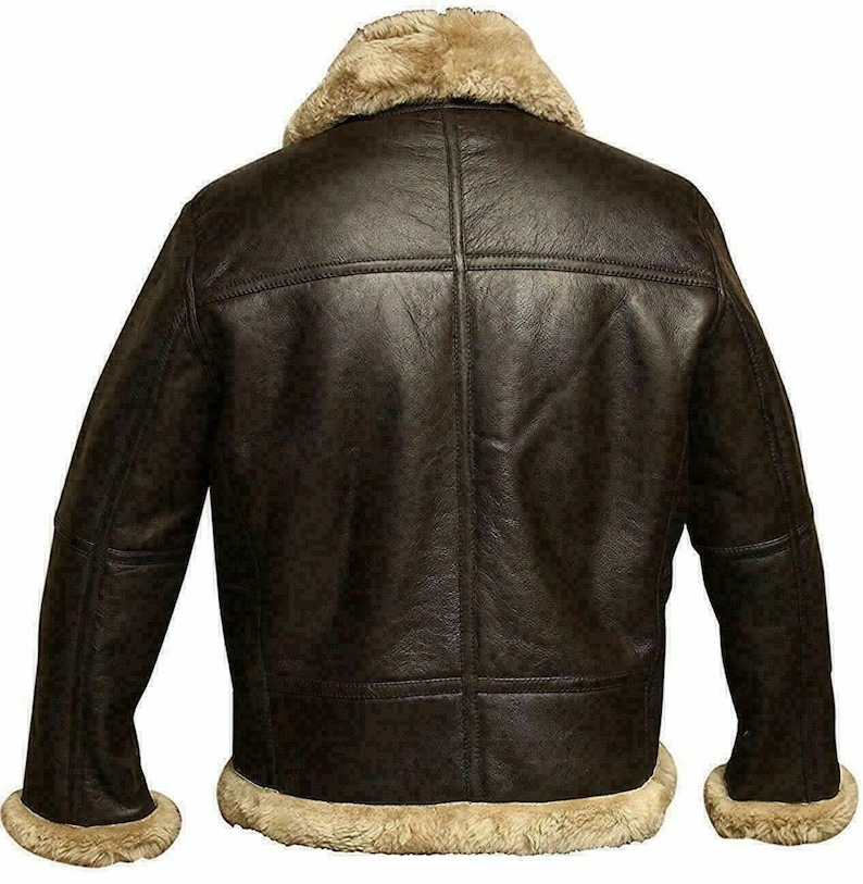 May include: A brown leather bomber jacket with a shearling collar and lining. The jacket has a zipper closure and two pockets.