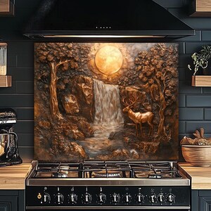 May include: A bronze-toned kitchen splashback with a detailed relief of a forest scene. A waterfall cascades under a full moon, with a deer standing near the water. Trees and rocks frame the scene, creating a nature-inspired design.