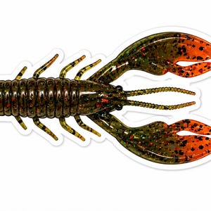 May include: A detailed image of a plastic crawfish lure. The lure is primarily dark green with orange claws and accents. It has a segmented body, multiple legs, and detailed antennae, designed for attracting fish.