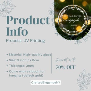 May include: A circular glass ornament featuring a white printed wreath design with the text Sophia & Daniel, engaged, and the date 11.16.2026. The ornament is 3 inches in diameter, 3mm thick, and includes a gold ribbon for hanging via UV printing.