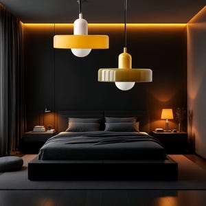 May include: Two modern yellow pendant lights with white shades hang over a black bed in a dark bedroom with a gray rug.
