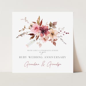 May include: A square card with a watercolor floral design in shades of pink, burgundy, and beige. The card reads "Ruby Wedding Anniversary" and "Grandma & Grandpa" with the text "Est. 1984".