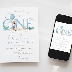 May include: A light blue and white first birthday invitation featuring a watercolor illustration of Peter Rabbit holding a balloon. The invitation includes the text "Charlie's First Birthday" and event details.