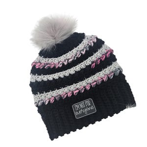Stay Warm in Style with this Beanie featuring Detachable Faux Fur Pom