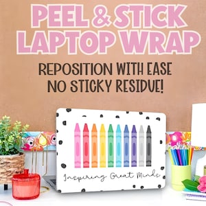 May include: A white laptop wrap with a colorful crayon design and black polka dots. The wrap has the text "Inspiring Great Minds". The background includes the text "PEEL & STICK LAPTOP WRAP" and "REPOSITION WITH EASE NO STICKY RESIDUE!"