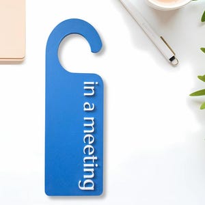 May include: A rustic wooden sign with the text "Welcome to our home" in white lettering. The sign features a distressed finish and a simple, inviting design, perfect for front door decor.