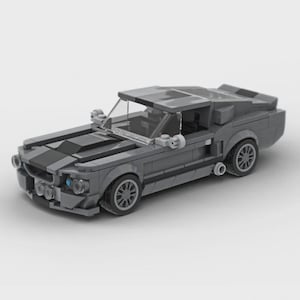 May include: A gray toy car constructed from interlocking blocks. The model features a sleek design with black racing stripes on the hood, a windshield, and detailed wheels. The car is a classic muscle car style.