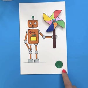 以下が含まれることがあります： カラフルな風車を持った、オレンジ色のディテールを持つ茶色のロボットの絵。 ロボットは長方形の体をしており、白い紙に描かれています。 背景は青色で、テキスト「@moonshotkidz」があります。