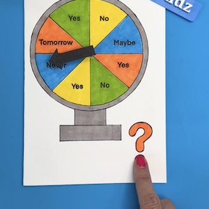 May include: A colorful decision-making wheel with segments labeled "Yes," "No," "Maybe," "Tomorrow," and "Never." A black arrow indicates the choice. A question mark is drawn below the wheel. The text "@moonshotkidz" is displayed.