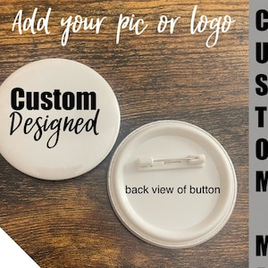 May include: A white button with the text "Custom Designed" in black lettering. The button is 2.28 inches in diameter. The back of the button is shown with a pin attached. The text "Submit your pics/info I design it Then ship to you" is written below the button. The text "CUSTOM MADE" is written vertically on the right side of the image.