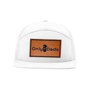 May include: White trucker hat with a mesh back and a flat brim. The hat features a brown leather patch with the text "Only Dads" and a beard graphic.