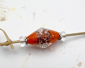 Poppy Orange Lampwork Bicone With Silver Starbursts Focal Bead With Lampwork Crystal Spacers And Tierra Cast Silver Swirls Spacers