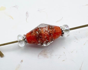 Starburst Orange Lampwork Bicone With Silver Starbursts Focal Bead With Lampwork Crystal Spacers And Tierra Cast Silver Swirls Spacers