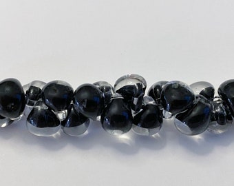 Black Unicorne Beads Boro Teardrops, 25 Beads Per Strand, Clear Boro Glass With Black