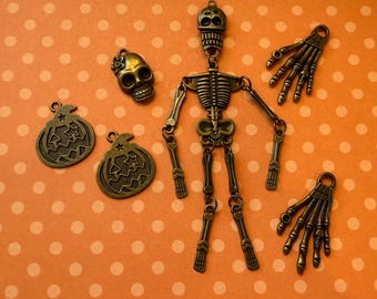 A Set of Halloween Charms, 2 of Each, Jack O Lantern and Skeleton Hands, 1 Ghost Head, 1 Full Skeleton Halloween Charms, 6 Pieces Total