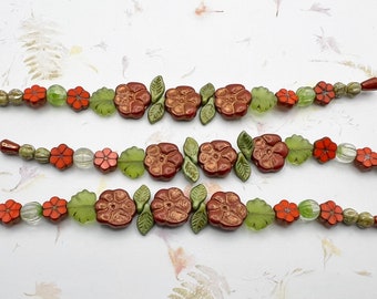Flowers and Leaves, Czech Glass Mix, 7 Inch Strand of Assorted Table Cut and Pressed Czech Glass Beads in Reds and Greens