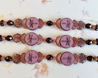 Pink Purple Bead Strand Mix, 7 Inch Strand of Assorted Sizes, Table Cut Czech Glass Dragonfly Beads, Maple Leaves and more in Purple Pink