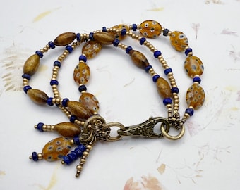 A Thousand Flowers, Multi Strand Lapis and Millefiori and Lamp Work Beads, Antique Bronze Findings and Details