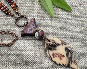 A Little Bird Told Me, 26 Inch Over the Head Necklace, A Sweet Polymer Clay Bird Bead and Disk with a Mixed Media Leaf Pendant