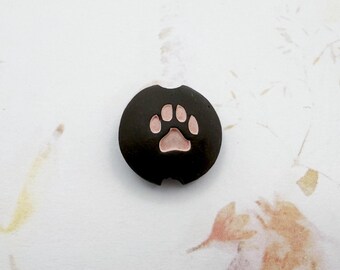 Pink Puppy Paw on Black Clay, Small Lentil Shaped Beads, Stamped and Pigment Rubbed Beads, Golem Design Studio