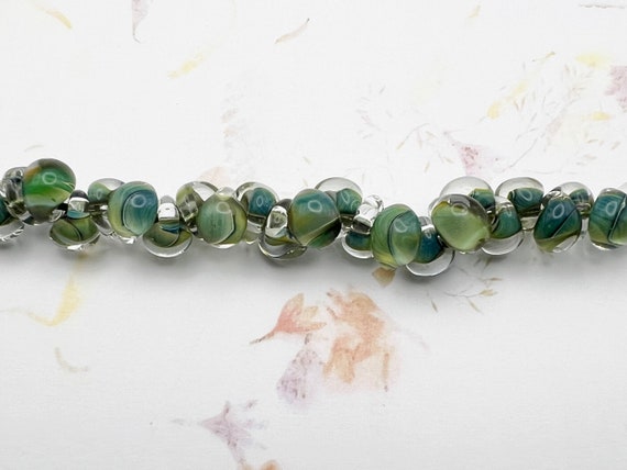 Multi Forest Unicorne Beads Boro Teardrops, 25 Beads Per Strand, Mixed Shade of Greens and Blue on Each Bead