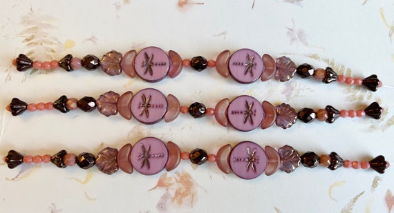 Pink Purple Bead Strand Mix, 7 Inch Strand of Assorted Sizes, Table Cut Czech Glass Dragonfly Beads, Maple Leaves and more in Purple Pink