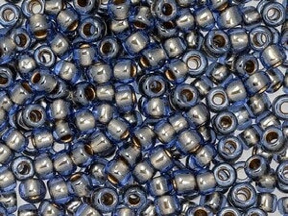 TOHO Size 6/o Round Seed Beads, Color Number 992c Gold Lined Light Montana Blue, 8 to 9 grams per 2.5 Inch Tube