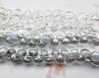 Silvery Sea Bead Grouping, Unicorne Boro Teardrops, 25 Beads per Strand x 4 Strands, 2 Each of Clear and Mystique Pearl