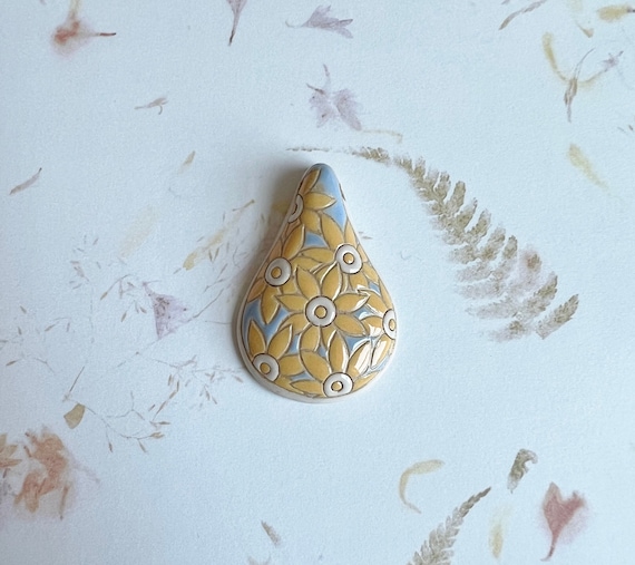 Yellow Daisies, A Drop Shaped Stoneware Pendant, Hand carved And Hand Painted, Glazed On Both Sides, Drill Hole Is Approximately 2.6mm