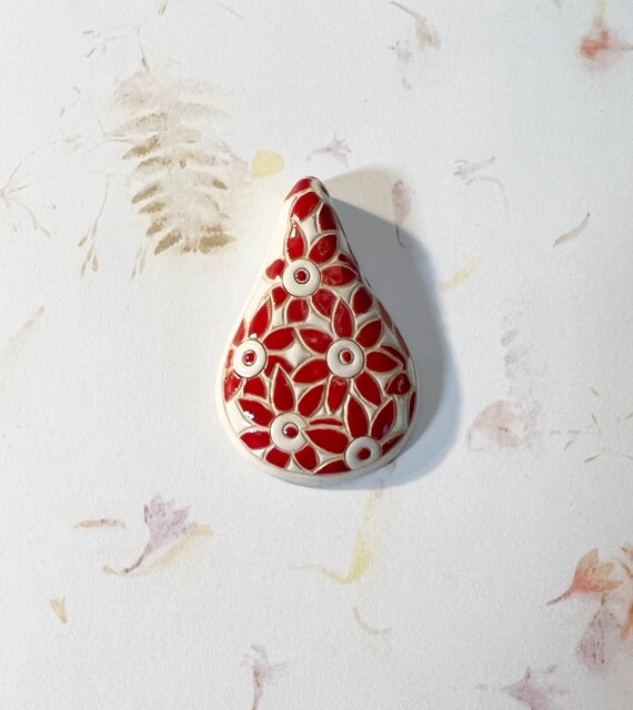 Red Daisies, A Drop Shaped Stoneware Pendant, Hand carved And Hand Painted, Glazed On Both Sides, Drill Hole Is Approximately 2.6mm