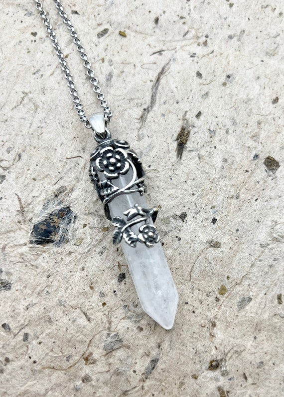 A Pretty Crystal Quartz Pendant Wrapped in an Open Work Floral Design, 30 Inch Necklace