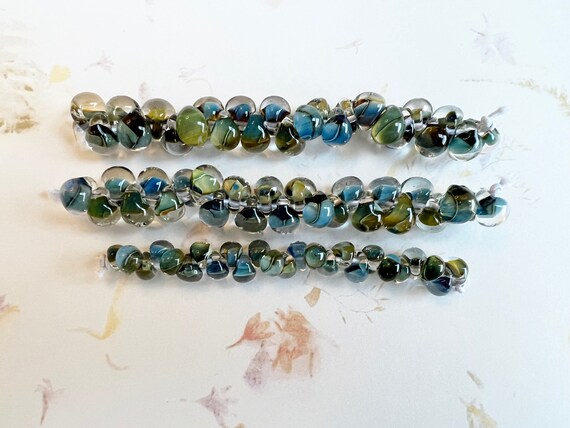 Multi Forest Grouping, Unicorne Beads Boro Teardrops, 25 Beads Per Strand x 3 Strands, Mixed Blues And Greens On Each Bead