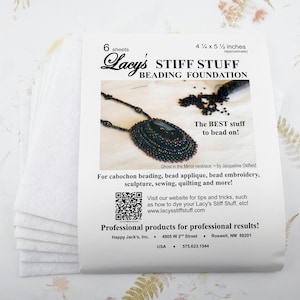 May include: A stack of six white Lacy's Stiff Stuff beading foundation sheets. The packaging features a beaded necklace image and text that reads "The BEST stuff to bead on!" The package is approximately 4.75 x 5.5 inches.