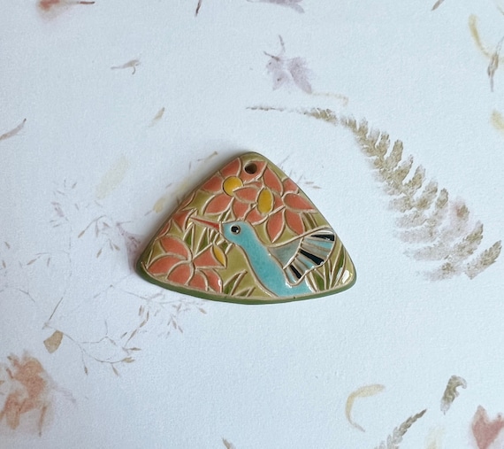 Hummingbird Pendant, A Triangle Shaped Stoneware Pendant, Hand Carved And Hand Painted, Glazed On Both Sides