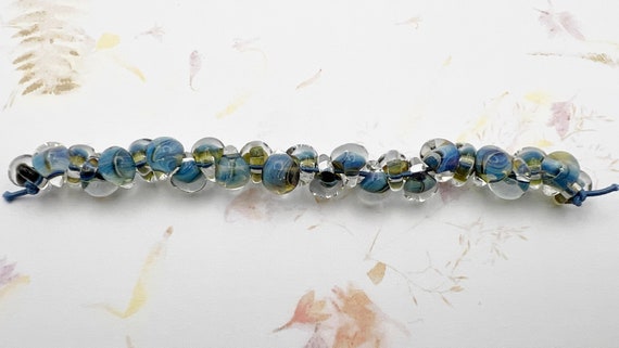 Dark Sky Blue Unicorne Beads Boro Teardrops, 25 Beads Per Strand, Mixed Shade of Blue on Each Bead