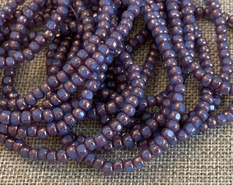 4x3mm Trica Thistle with a Purple Metallic Finish, Fire Polish Beads, 50 Beads Per Strand, 1mm Center Hole, Trica Beads