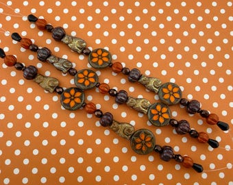 Czech Glass Bead Strand: Orange Flower, Metallic Cats, Autumn Tones