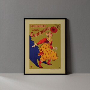 May include: Framed vintage advertisement for Guignolet Cointreau, featuring a woman in a yellow dress with cherry designs, reaching for a large cherry. The poster has a green background with text in red and a blue shadow.